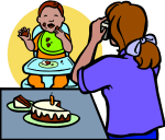 baby in high chair with birthday cake